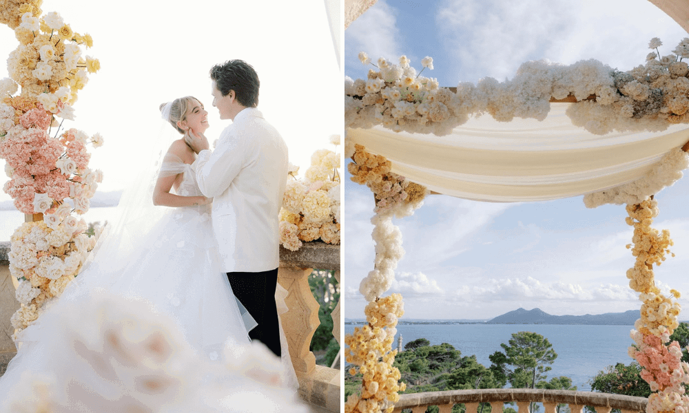 A couple posing on their wedding day in Mallorca. The wedding features chic and sophisticated pastel-hued florals